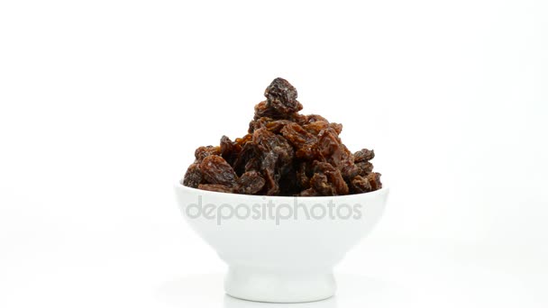 Raisins or dried grape food gyrating on white background — Stock Video