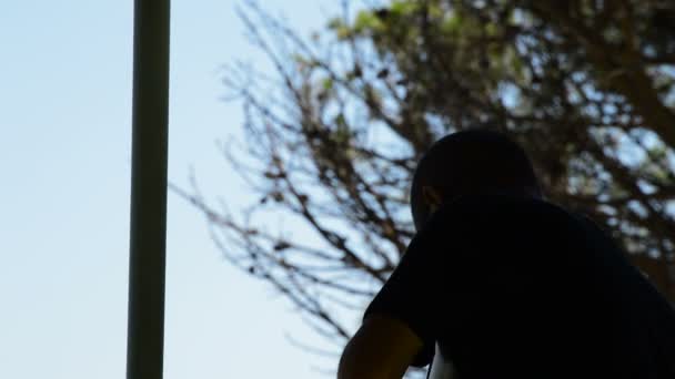 Silhouette of a shooter skeet in position aiming and firing in a championship — Stock Video