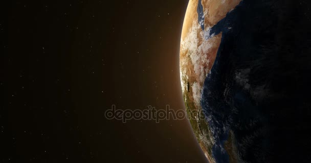 Planeta Terra ao nascer do sol iluminado pelo sol no espaço exterior — Vídeo de Stock