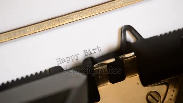 Typing the expression Happy Birthday with an old manual typewriter — Stock Video