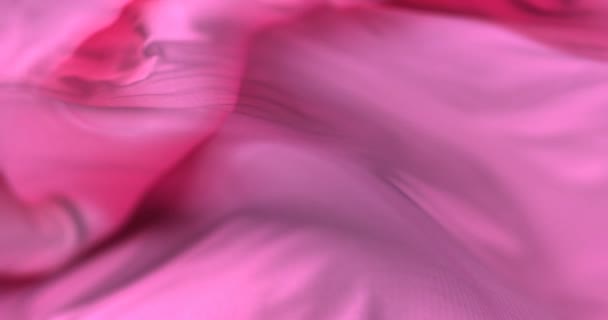 Roze doek of zijde zwaaien op wind in traag, lus — Stockvideo