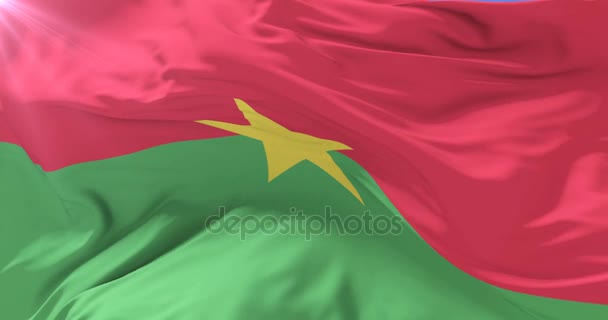 Буркіна-Фасо прапор махав на дихання в повільно з синього неба, петля — стокове відео