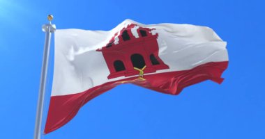 Gibraltarian bayrak, mavi gökyüzü, rüzgarla sallayarak döngü