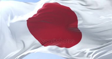 Japon bayrağı sallayarak rüzgarda, yavaş mavi gökyüzünde döngü