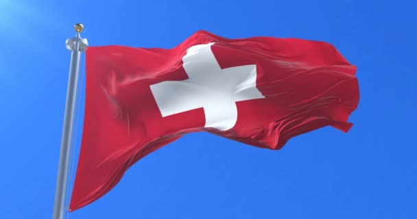 瑞士国旗在蓝色的天空中缓缓摇曳 — 图库视频影像