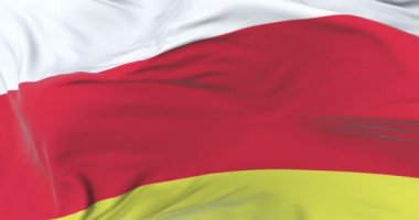 Osetya bayrak sallayarak rüzgarda, yavaş mavi gökyüzünde döngü