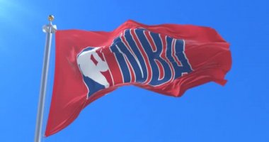 Kırmızı bayrak Nba, National Basketball Association, mavi gökyüzü ile Rüzgar sallayarak logosu ile döngü