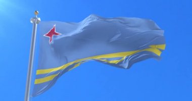 Aruba bayrak sallayarak rüzgarda, yavaş mavi gökyüzü ile döngü