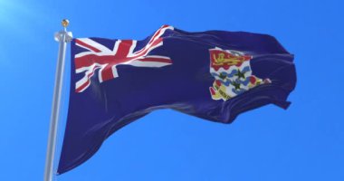 Cayman Adaları bayrağı mavi gökyüzü ile Rüzgar sallıyor, döngü