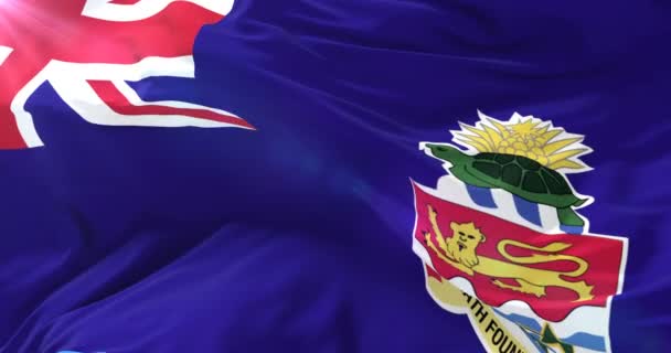 ケイマン諸島の旗風と青い空に手を振って ループ — ストック動画