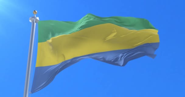 Flaga Gabonu Macha Wiatr Niebieski Niebo Pętlę Powolne — Wideo stockowe