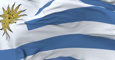 Uruguay bayrak sallayarak rüzgarda, yavaş mavi gökyüzü ile döngü