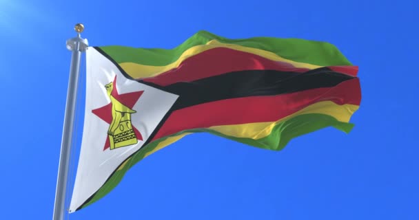 Zimbabwe Vlag Zwaaien Wind Langzaam Met Blauwe Hemel Lus — Stockvideo