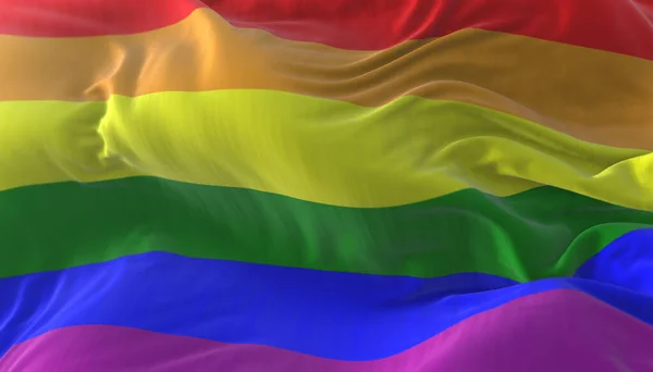 The rainbow flag, LGBT pride flag or gay pride flag waving
