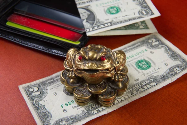Money frog and two dollars. — Stock Photo, Image
