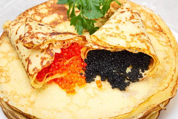 Pancakes with red and black caviar. — Stock Photo, Image