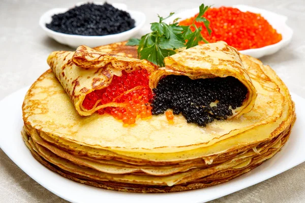 Pancakes with red and black caviar. — Stock Photo, Image