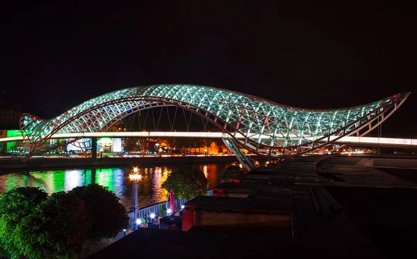 The Bridge of Peace at night, Bridge of Peace is a pedestrian bridge over the Kura River  in Tbilisi, Georgia.