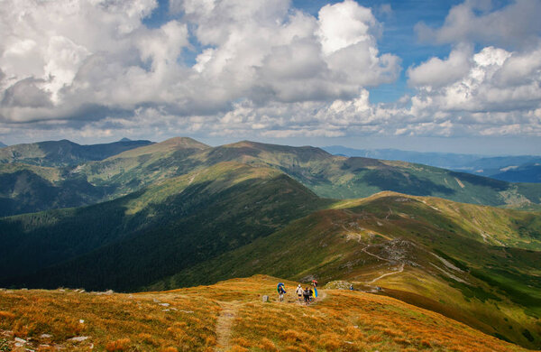 tourists are resting in the mountains. Walks in the mountains. C