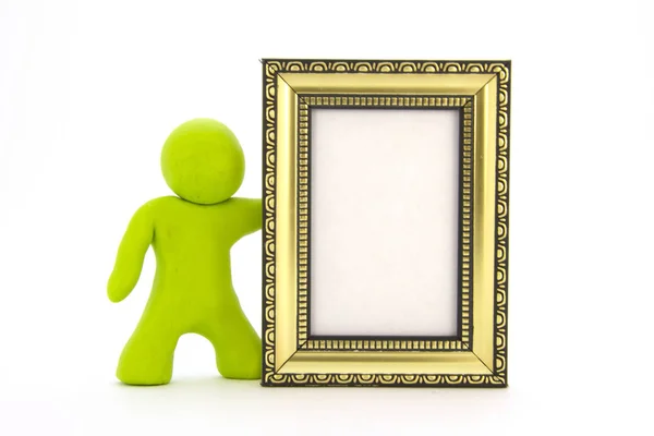 Caractère plasticine vert lime et cadre photo or. Isolé sur fond blanc — Photo