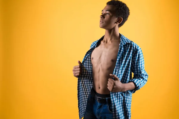Thin African American teen shows bare torso. — Stock Photo, Image