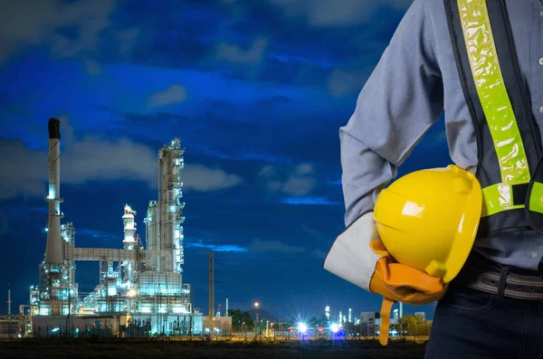 Engineer holding a yellow helmet