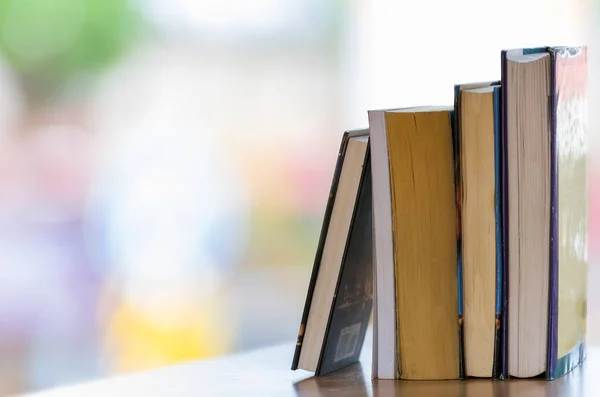 Books on the table with natural backdrop. — Stock Photo, Image