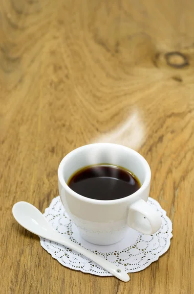 Coffee in cup on table — Stock Photo, Image