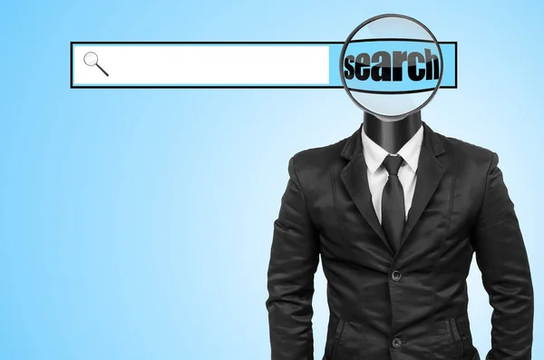 Suit with magnifying glass head — Stock Photo, Image