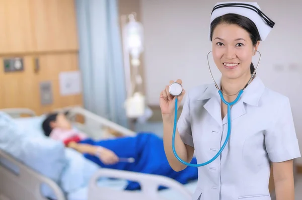 Smiling Asian nurse with stethoscope — Stock Photo, Image