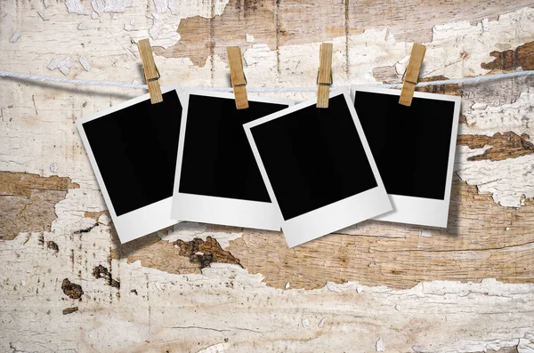 Blank photo frames with clothespins — Stock Photo, Image