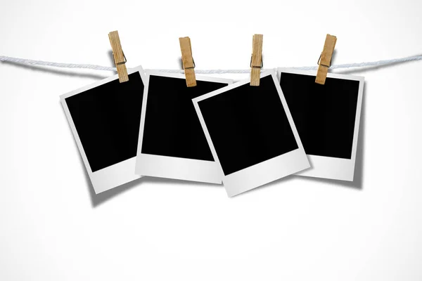 Blank photo frames with clothespins — Stock Photo, Image