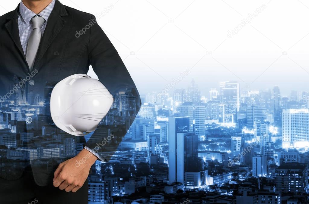 Engineer holding helmet 
