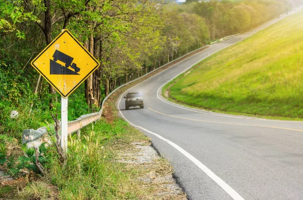Car driving on road with traffic sign — Stock Photo, Image