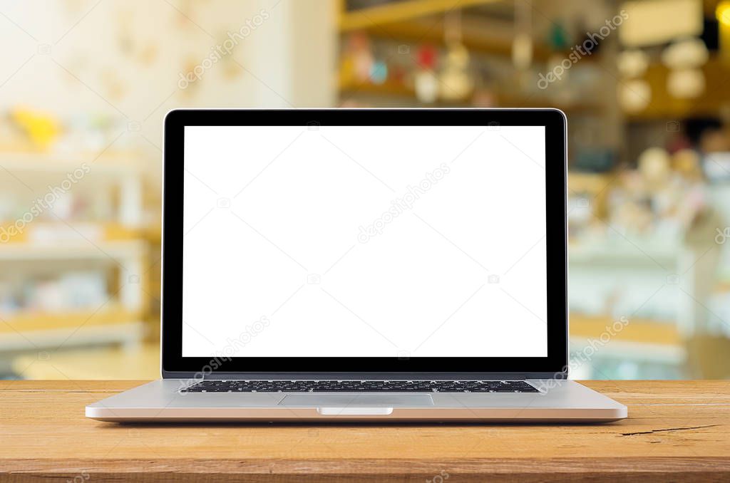  Laptop with blank screen on table