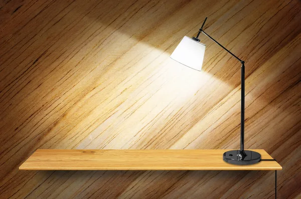 lamp on wooden bookshelf