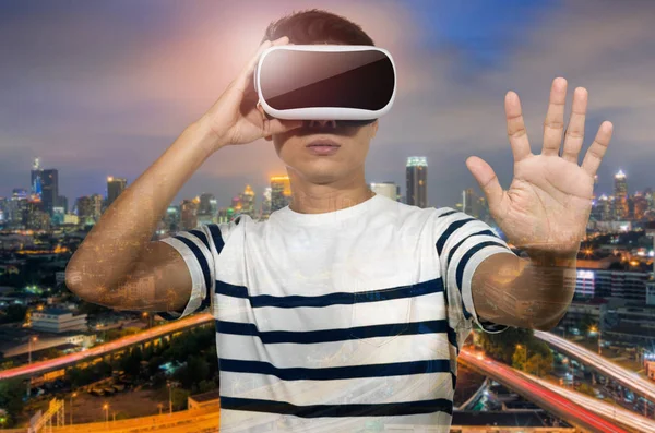 Young man in virtual glasses