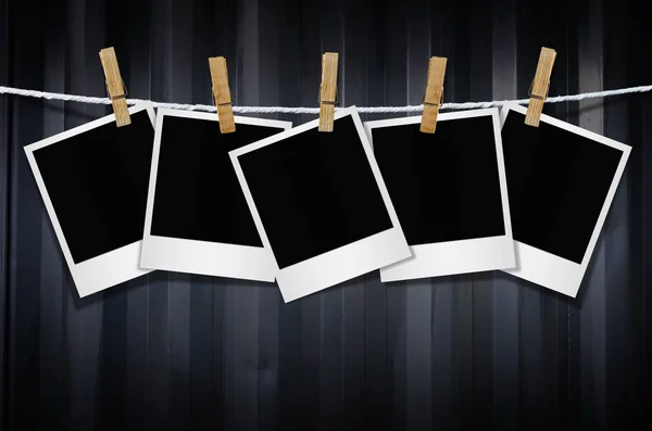 Blank photo frames with clothespins — Stock Photo, Image