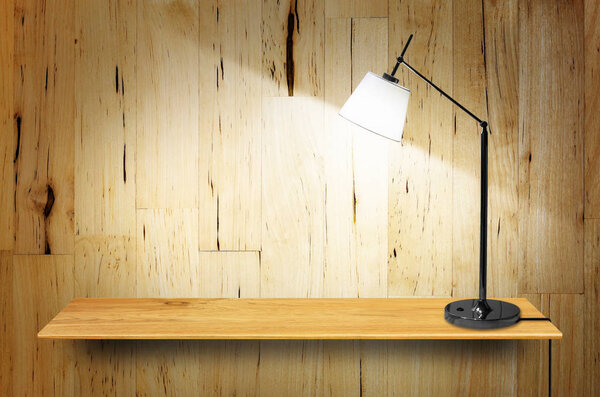 lamp on wooden bookshelf 