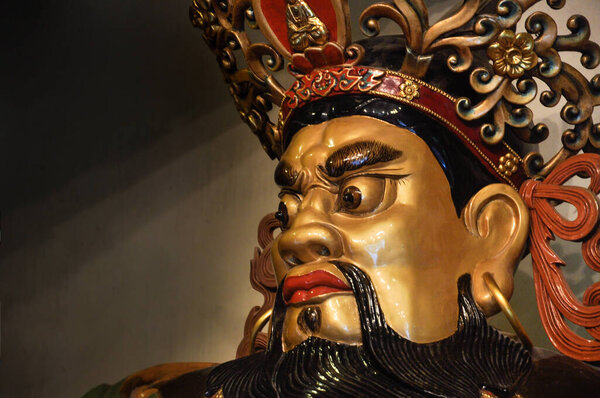 Face of God statue in entrance of the temple in side of the Po Lin Monastery. Lantau Island, Hong Kong