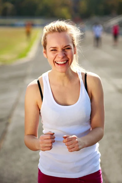 Joyful expressive girl jogging healthy lifestyle outdoors — Stock Photo, Image