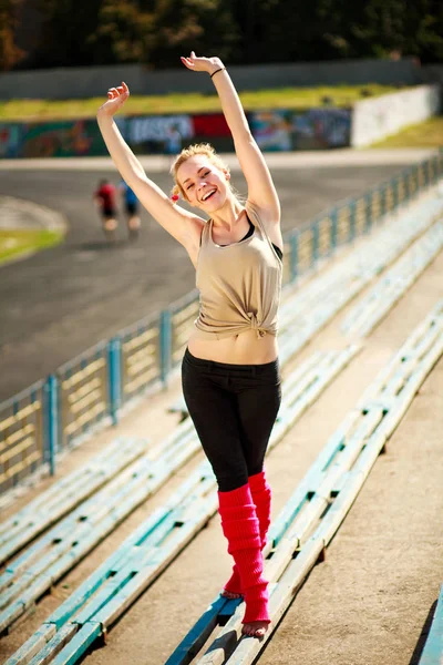 Happy girl ballerina at stadium enjoying life on sunny day — Stock Photo, Image