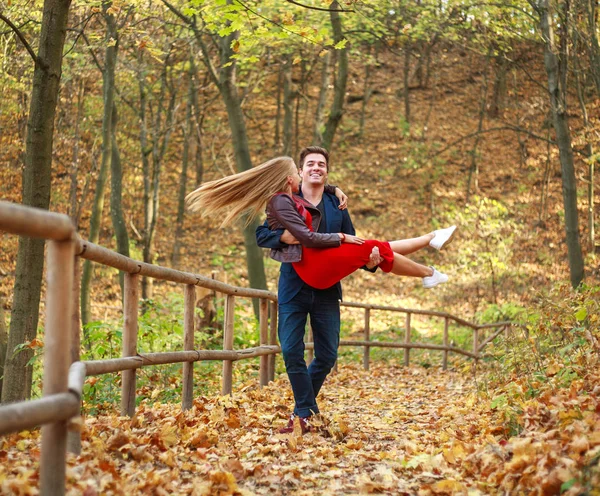 Happy newlyweds couple in love in forest park having fun — Stock Photo, Image