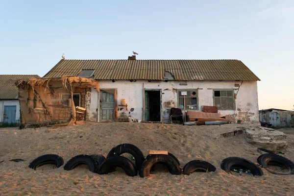 Fisherman\'s house on the seashore at sunrise