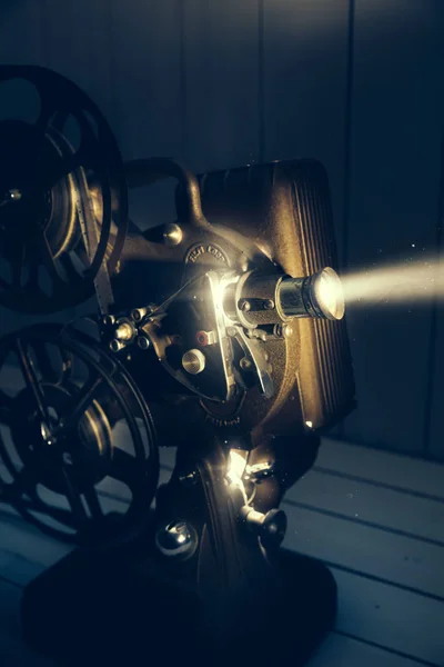 Film projector with dramatic lighting