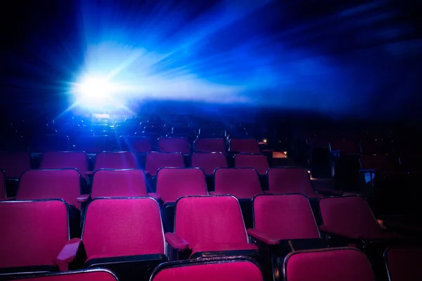 Movie theater with empty seats and projector — Stock Photo, Image