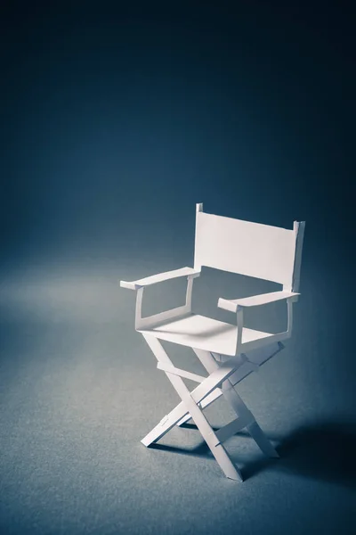 Paper director chair on a blueish grey background — Stock Photo, Image