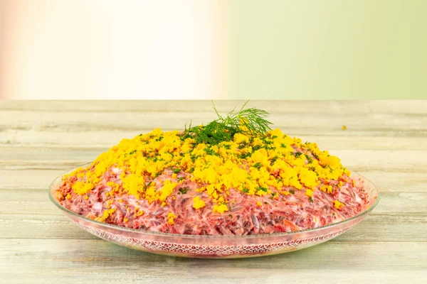 Traditional russian layered salad named herring under a fur coat