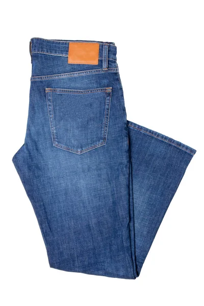 Männer Jeans isoliert. zusammengefaltete trendige, stylische Jeanshose für Männer in blau isoliert auf weißem Hintergrund. Modische Jeanshose für den Mann. — Stockfoto