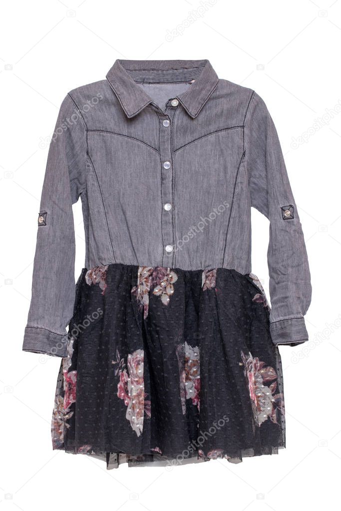 Clothes for children. Close-up of a beautiful gray and black girl dress with colorful pattern on black lace. Children spring and summer fashion.